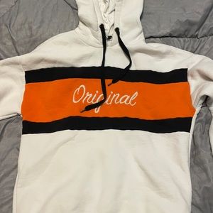 woman’s size small white orange and black original sweatshirt